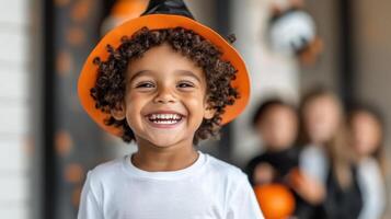 A young boy wearing a halloween hat photo