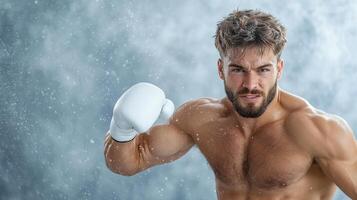 A shirtless man in boxing gloves photo