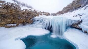 A frozen waterfall in the middle of a snowy mountain photo