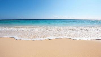 A sandy beach with a blue ocean and white waves photo