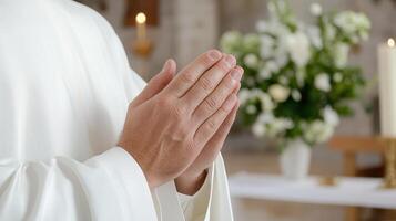 A priest is praying in front of a church photo