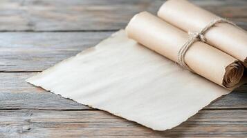 Roll of paper on wooden table photo