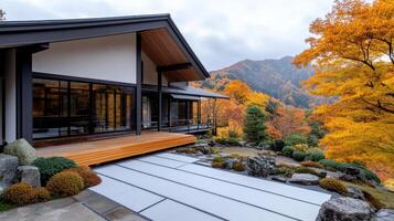 A house with a wooden deck and a mountain view photo