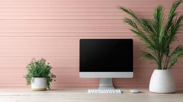 A computer monitor, keyboard and mouse on a wooden desk photo