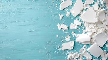 White cracked plaster on blue wall background photo
