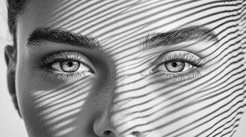 A woman with a black and white photo of her eyes