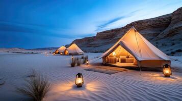 Tents in the desert lit up at night photo