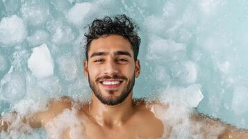 A man smiling in a hot tub with bubbles photo