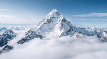 A mountain is surrounded by clouds photo