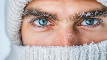 A man with blue eyes wearing a winter hat photo