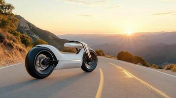 A white motorcycle on the road with the sun setting photo