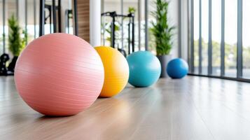 Fitness balls in gym room with windows photo
