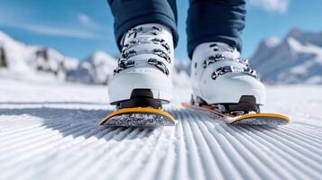 A person wearing skis on a snowy slope photo