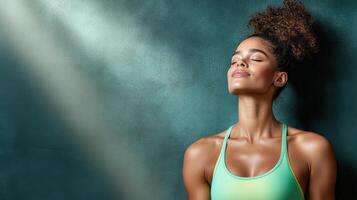 A woman in a sports bra top and green tank top photo