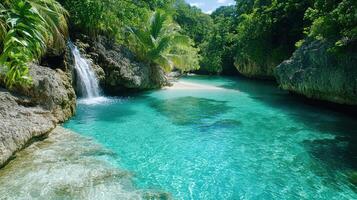 A waterfall and a beautiful beach in the middle of a tropical forest photo