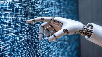 A robot hand is touching a computer screen photo