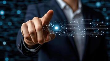 Businessman touching a digital interface on a dark background photo