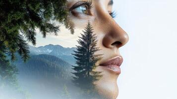A woman's face is covered with a forest and trees photo