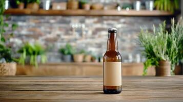 A beer bottle on a wooden table in front of a brick wall photo