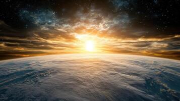The earth and sun rising over the horizon photo