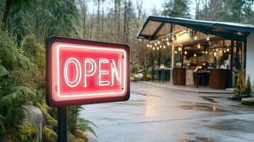 A red neon sign that says open photo