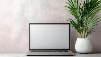Laptop with blank screen and palm tree on white background photo