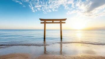 A tori gate on the beach at sunset photo