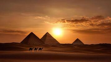 The sun sets over the pyramids of giza photo