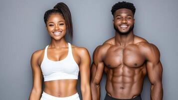 A man and woman in sports gear posing for the camera photo