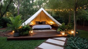 A tent with a bed and lights on photo