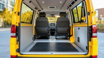 The interior of a yellow van with two seats photo