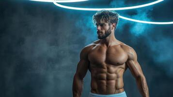 Muscular man in underwear standing in front of a neon light photo