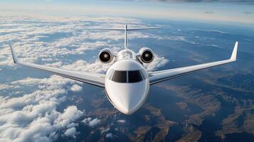 A private jet flying over the clouds photo