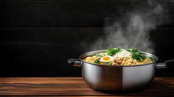 A pot with noodles and eggs on a table photo