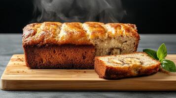 A loaf of banana bread on a cutting board photo