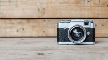 A vintage camera on a wooden table photo