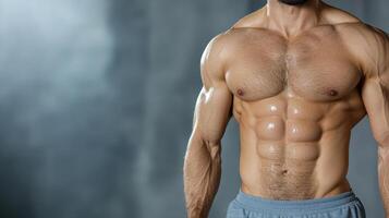 A man with a muscular body showing off his abs photo