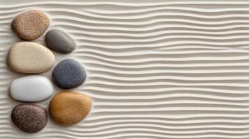 Pebbles on the sand with waves photo