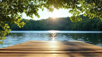 A wooden dock leads to a lake with trees photo