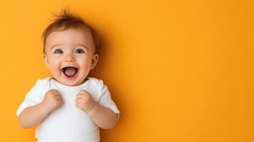 A baby is standing on an orange background photo