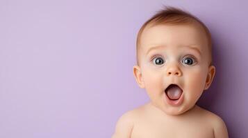 A baby with its mouth open on a purple background photo