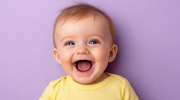 A baby laughing on a purple background photo