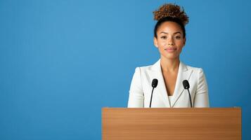 A woman in a business suit is giving a speech photo