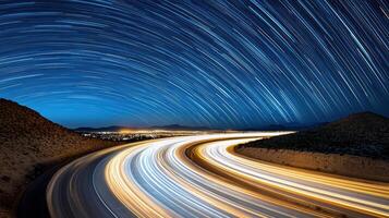 A long exposure photo of a highway with star trails
