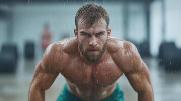 A man is doing pushups in the rain photo