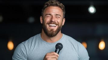 A man with a beard and a microphone photo