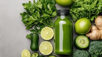 Green juice with lime, ginger, broccoli and other vegetables photo