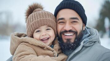 A man and a child are smiling in the snow photo