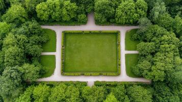 An aerial view of a square garden surrounded by trees photo