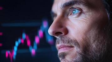 A man looking at a stock chart photo